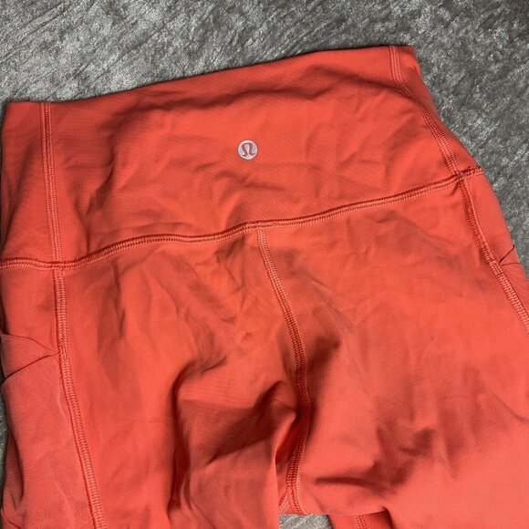 Lululemon Rise and Flow Pant Mesh Criss Cross Size 4 Orange Coral EUC - Picture 7 of 10